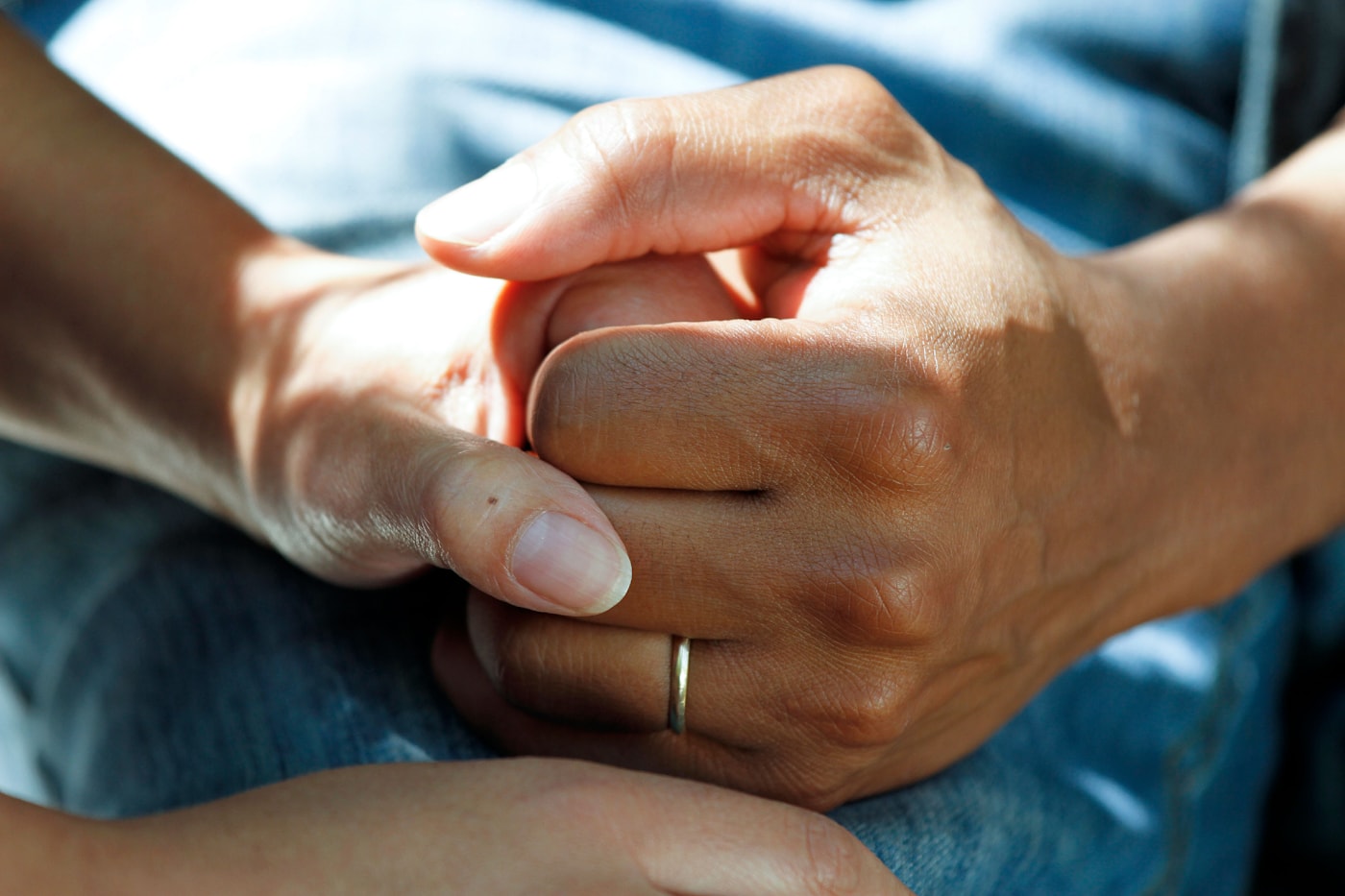 Hands held in a supportive moment